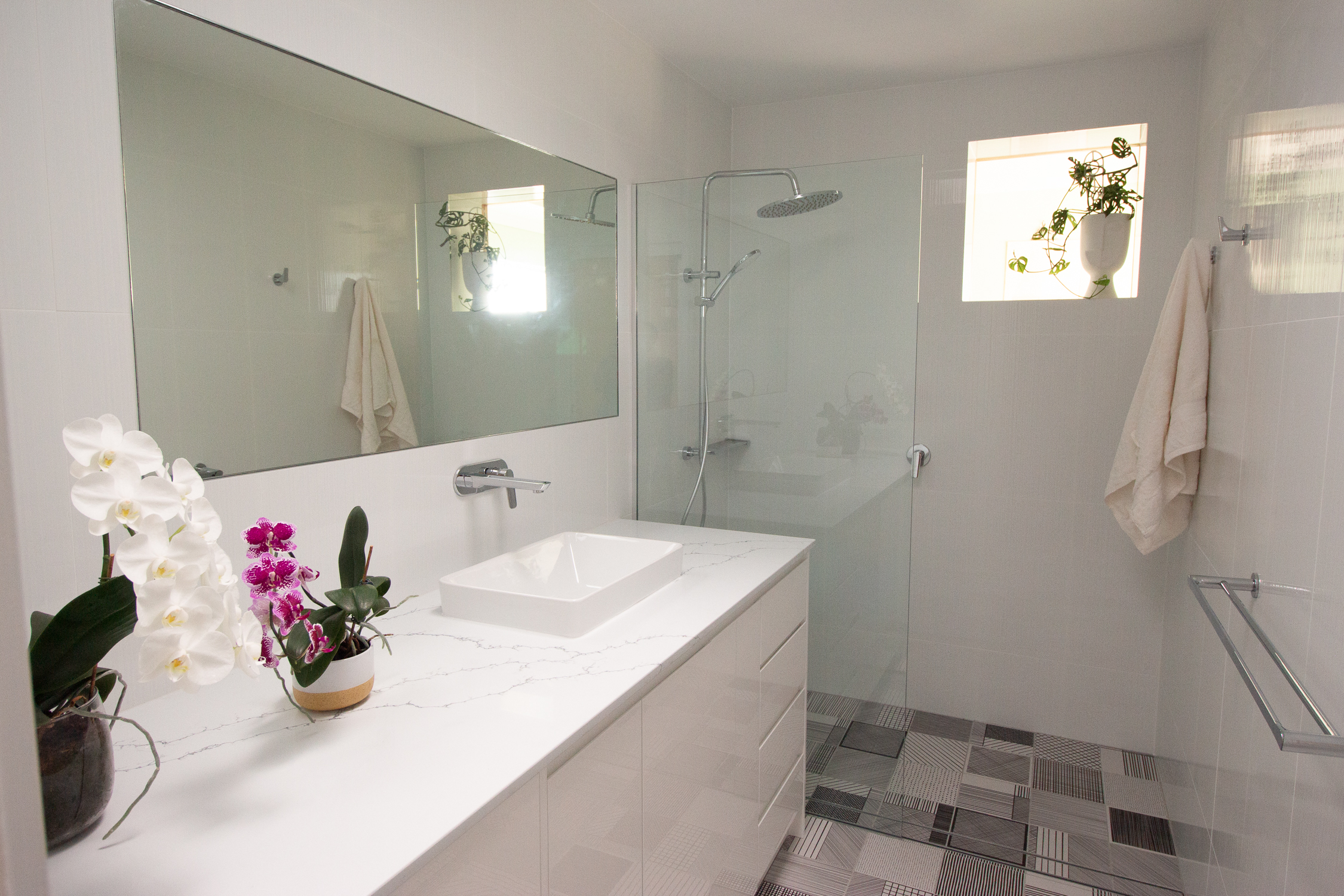 Bathroom with patterned tile floor