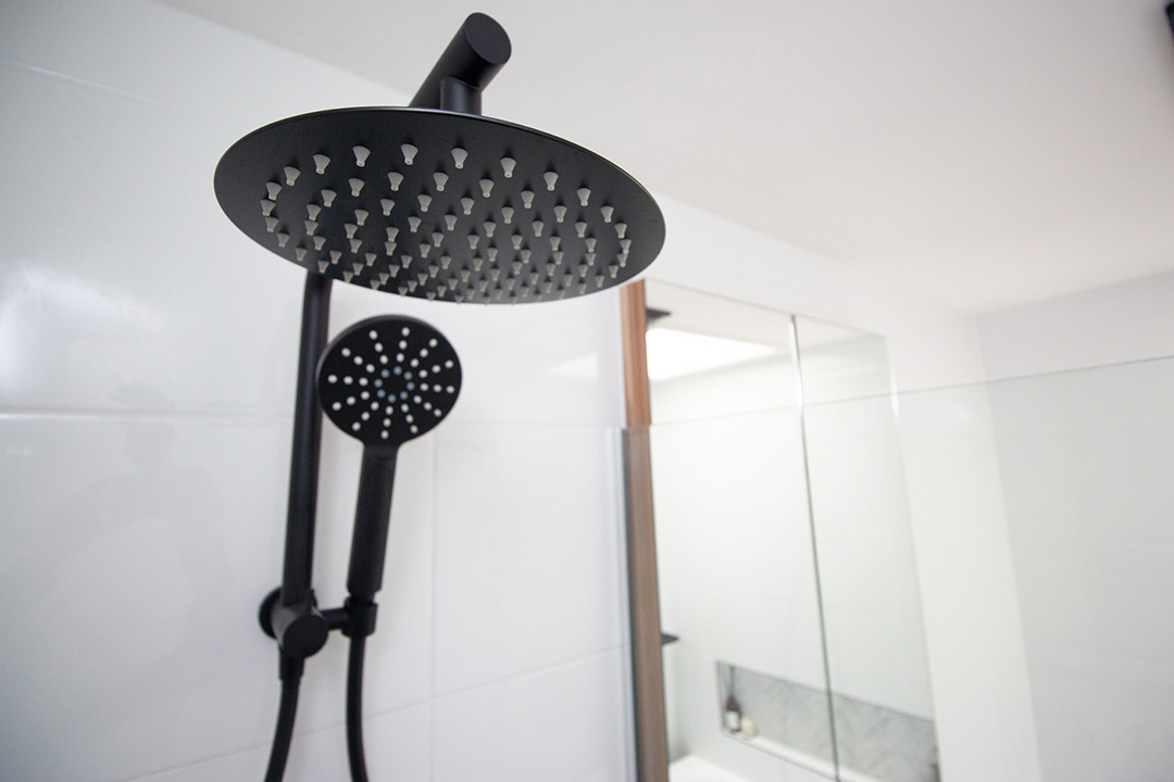 IMG_5930-1080 Black shower head in white tiled bathroom